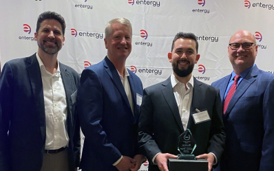 Four men standing for an award photo